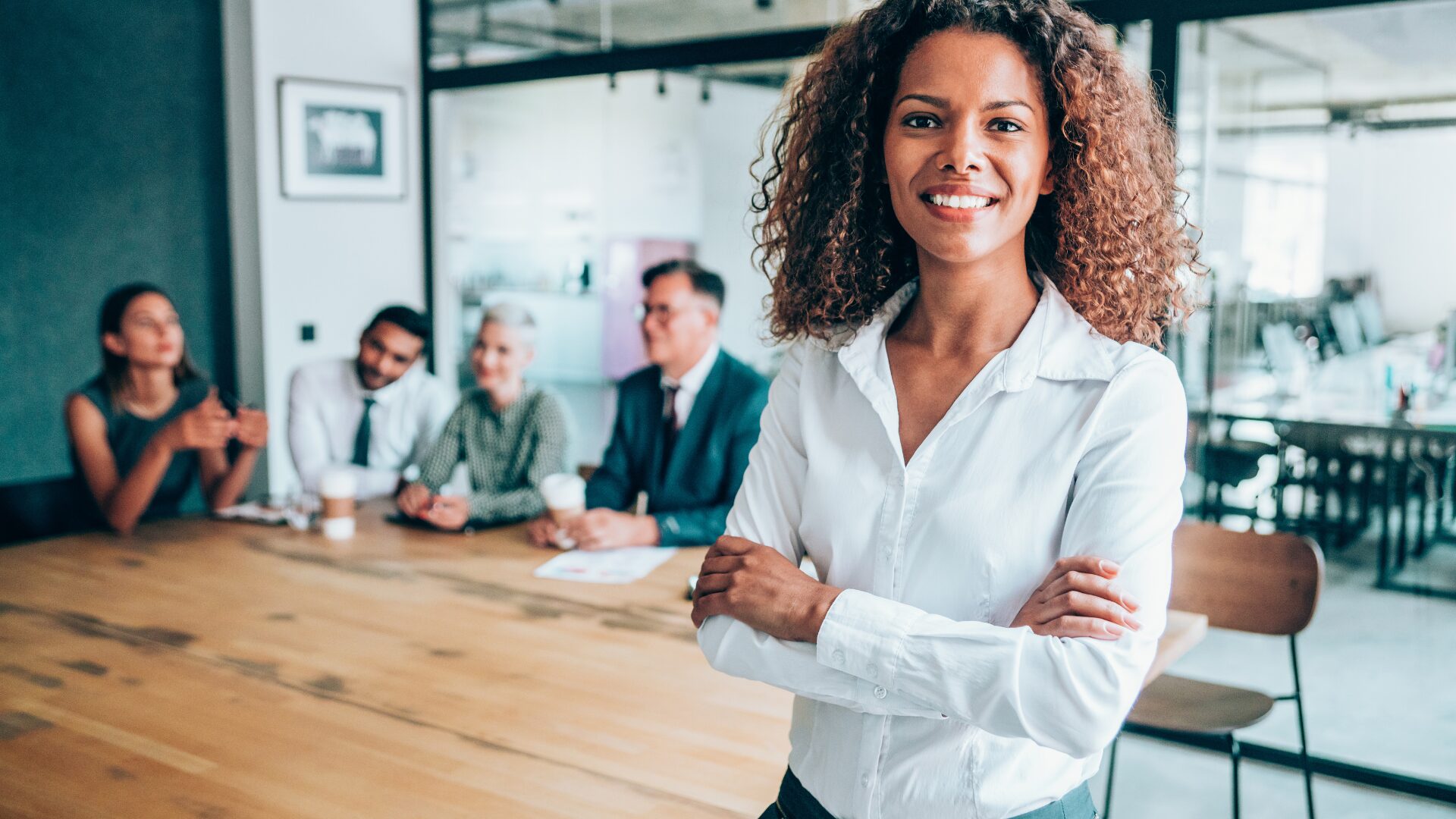 Woman smiling after accomplishing a concise checklist for their ESI Protocol, with the help of her team.