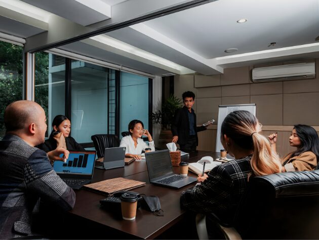 In-house legal team in a conference room reviewing analytics and strategy during a working session