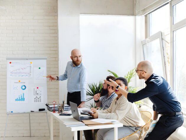 Team reviewing charts and analytics in a strategy meeting about building a structured litigation data system